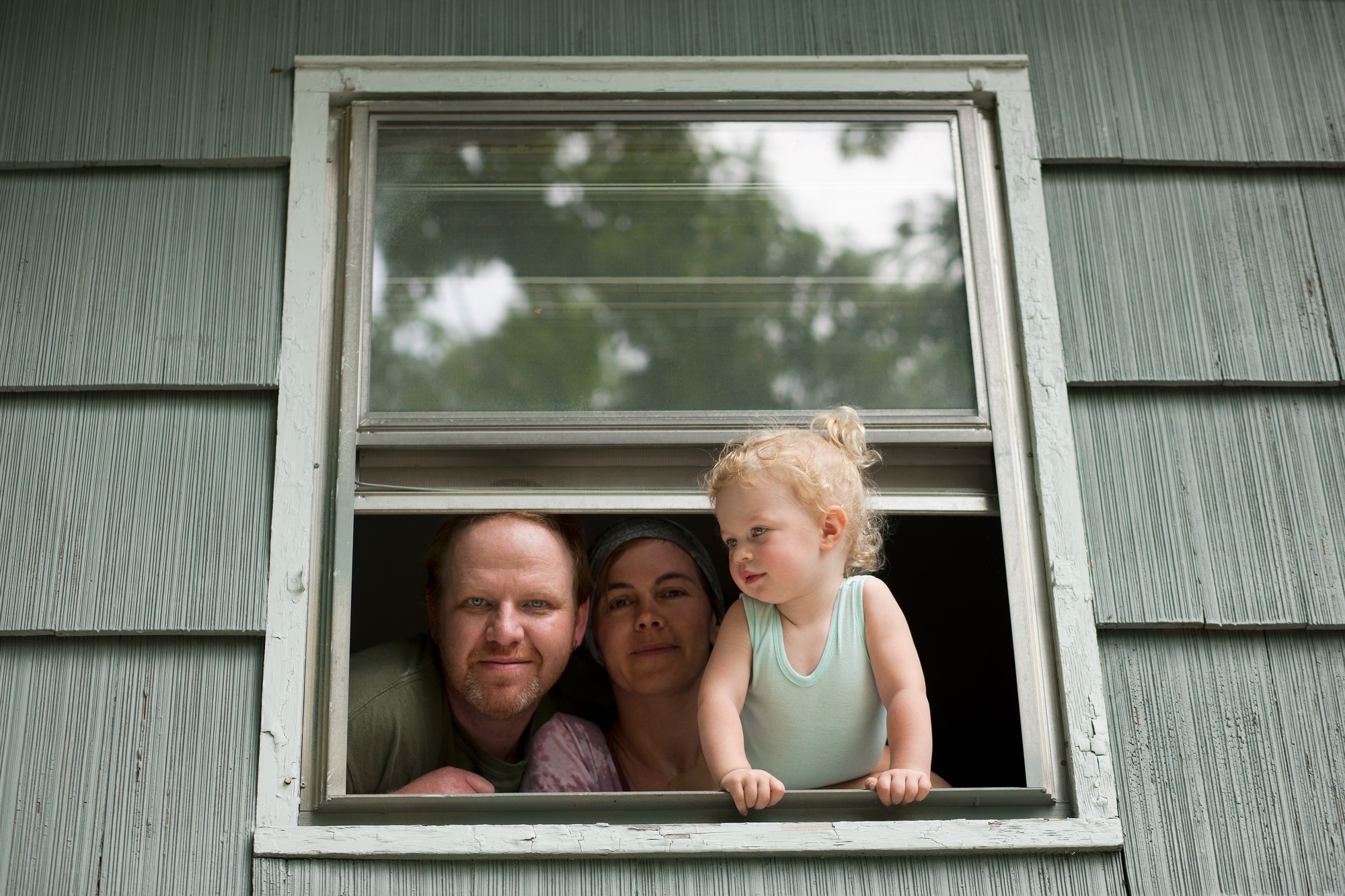 Family looking through window